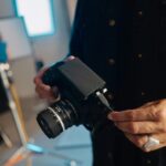 A man holding a camera in his hands