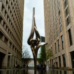 a statue in the middle of a body of water