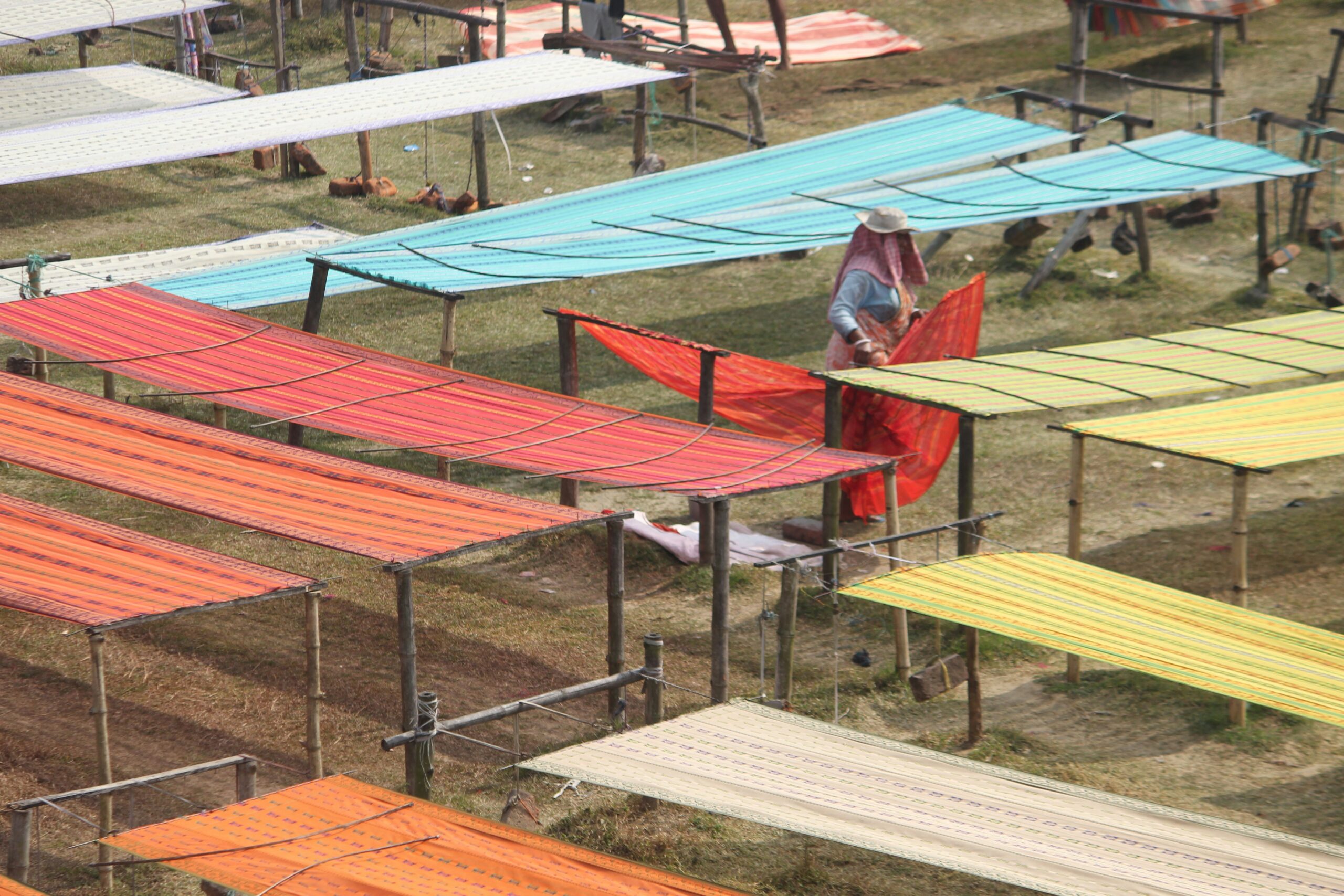 a woman is standing on top of a row of chairs