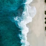 aerial photography of large body of water and shoreline