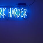 blue Work Harder neon signage